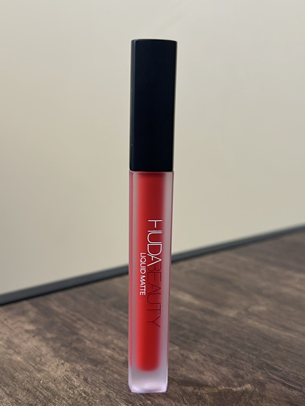 Huda Beauty red liquid matte lipstick in Alluring